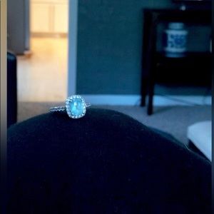 Blue topaz ring with white sapphire surrounding stones